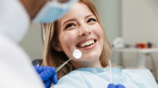 Woman smiling at her dentist before dental services in Nepean